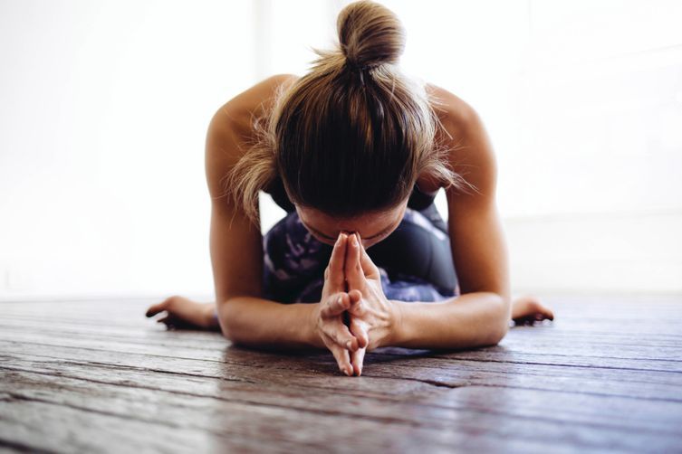 Five yoga poses to do at your desk - Vogue Australia